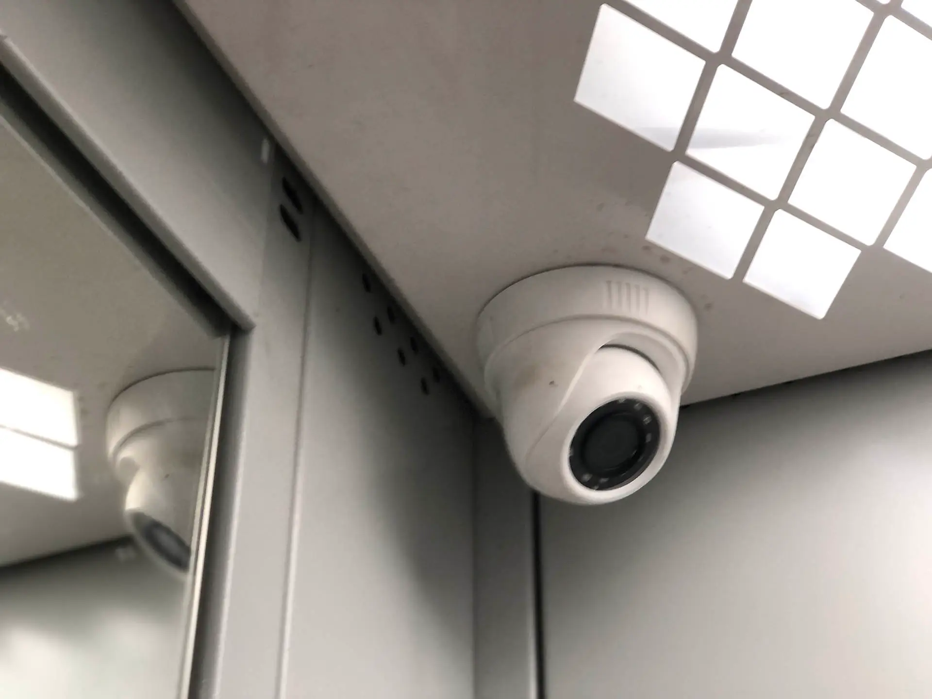 security-cctv-camera-on-the-ceiling-of-the-elevator