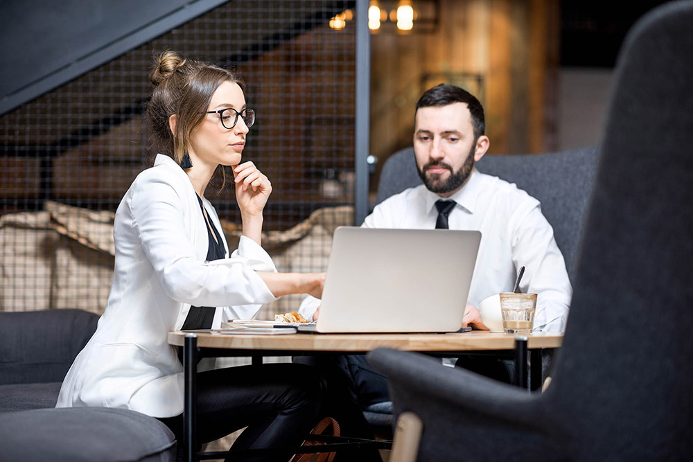 Businesss couple sitting in cafe