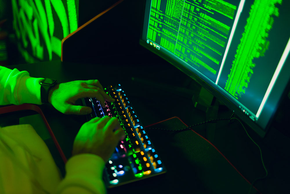 Hacker using computer malware software and hacking