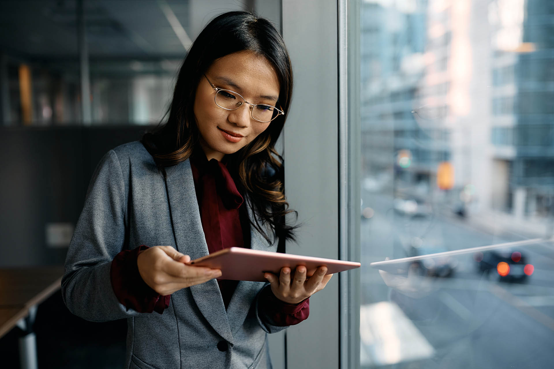 asian-female-executive-using-digital-tablet