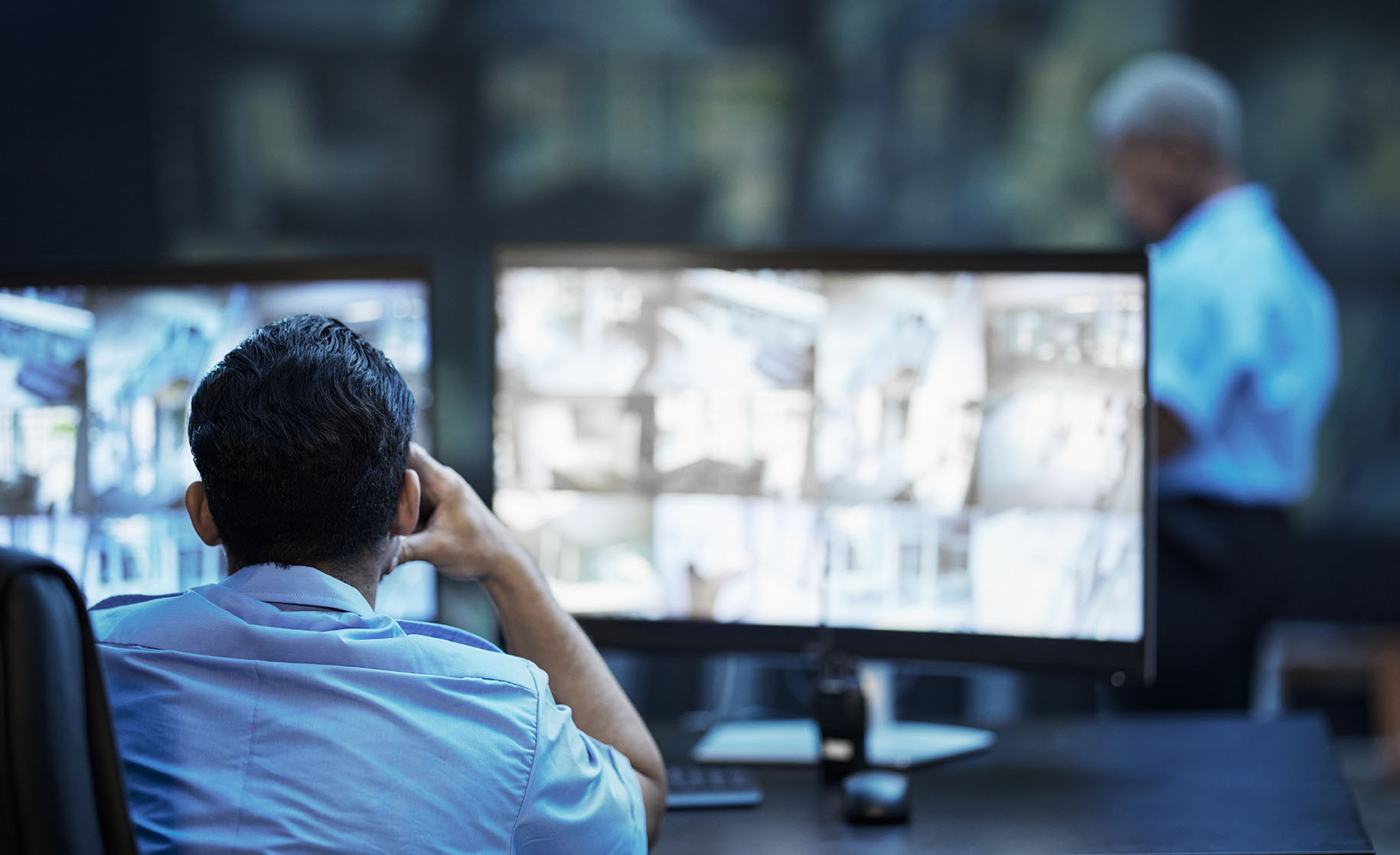 security-guard-in-control-room-man-checking-cctv