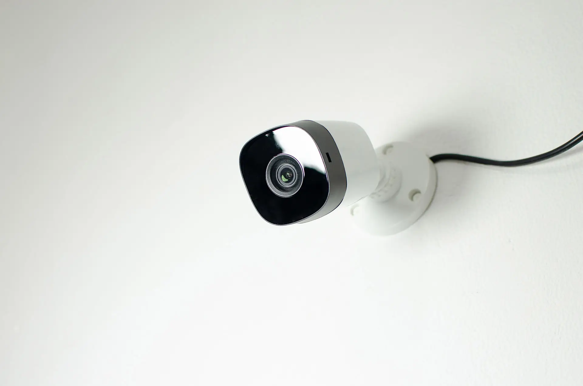 close-up-of-a-security-camera-mounted-on-a-wall