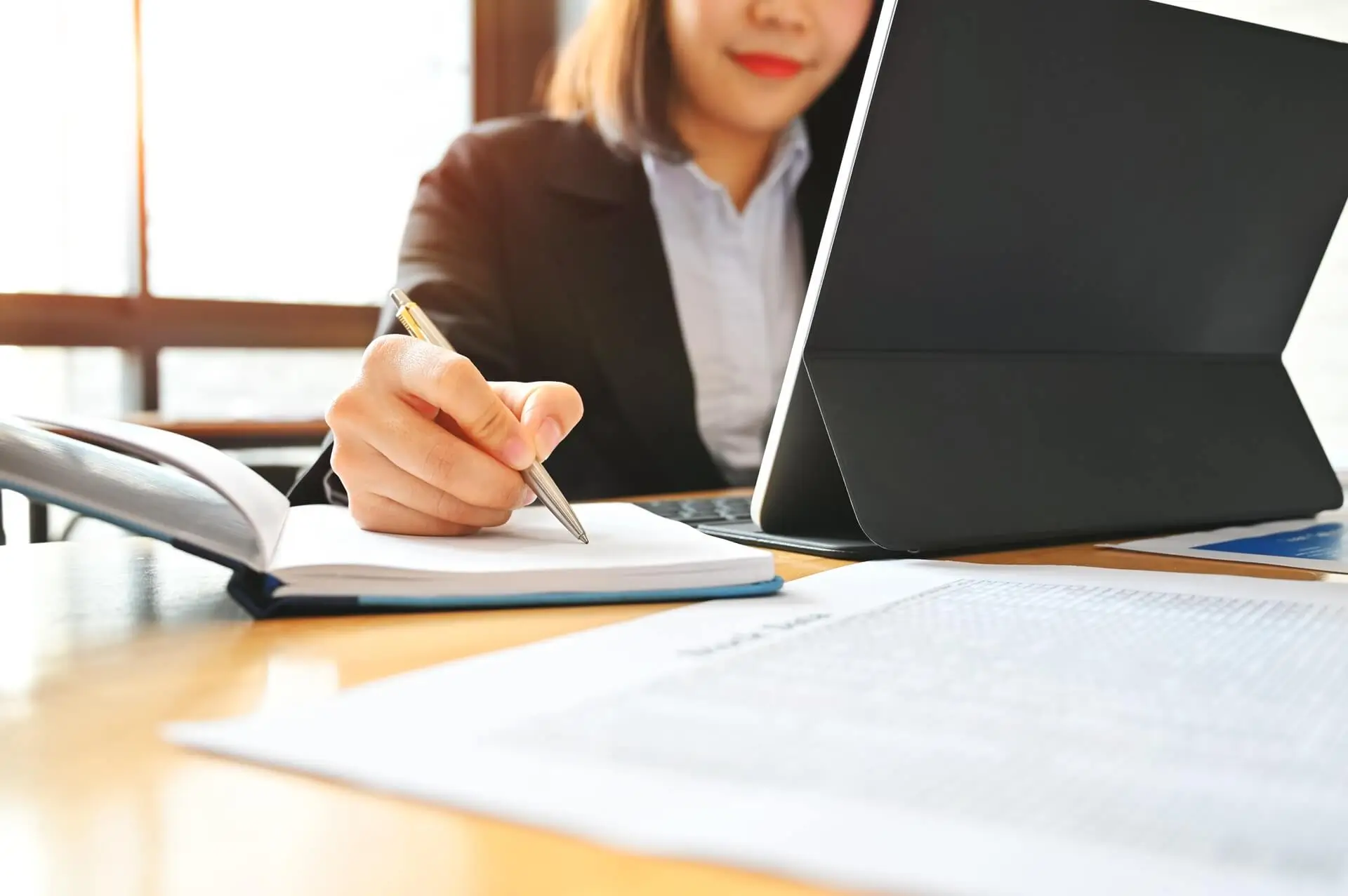 audit-business-woman-working-with-notebook-and-tab